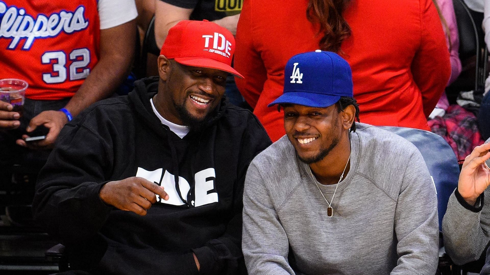 Anthony Tiffith (L) and Kendrick Lamar attend a basketball game between the Los Angeles Clippers and the Los Angeles Lakers at the Staples Center on April 5, 2015, in Los Angeles, California. (Image via Getty/Noel Vasquez)